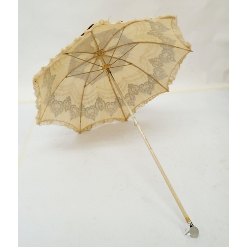 541 - A Victorian cream silk and black lace parasol, 96cm long