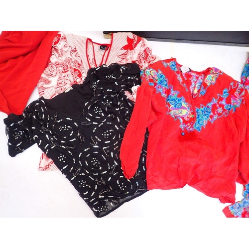 559 - A trunk of ladies designer clothes including Frank Usher red dress, navy skirt and sequin top plus a... 