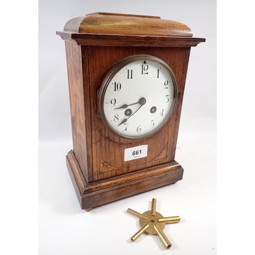 661 - An Edwardian oak clock with enamel face, 26cm tall