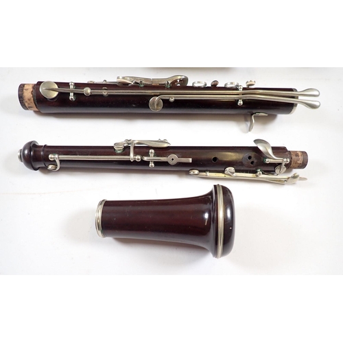 677 - An antique rosewood oboe stamped 'JTL' and a student clarinet - both cased