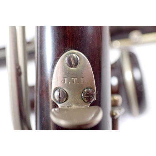 677 - An antique rosewood oboe stamped 'JTL' and a student clarinet - both cased