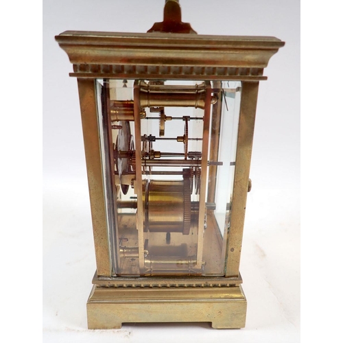 678 - A 19th century French brass carriage clock with travelling case and key, 12.5cm