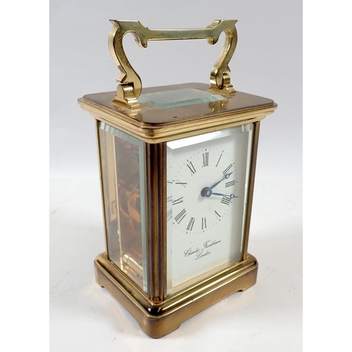 679 - A Charles Frodsham brass carriage clock with key, 11cm tall