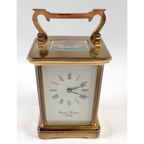 679 - A Charles Frodsham brass carriage clock with key, 11cm tall