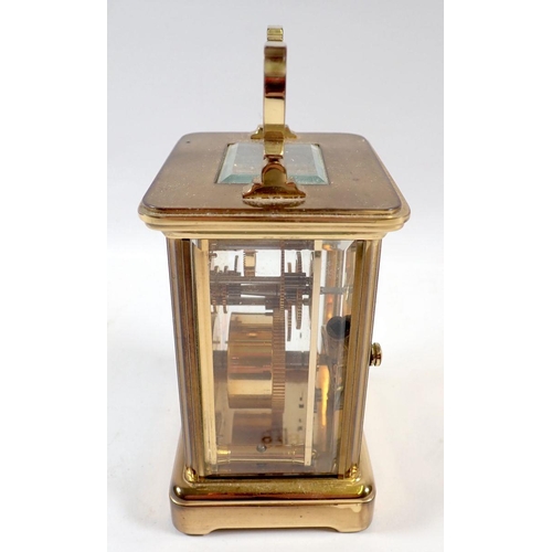 679 - A Charles Frodsham brass carriage clock with key, 11cm tall