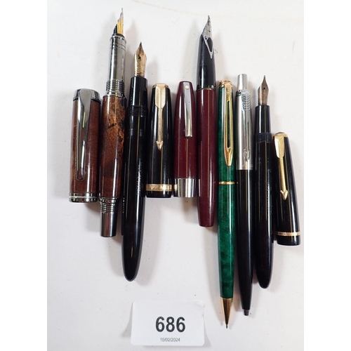 686 - A collection of six fountain and ballpoint pens including Parker