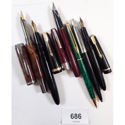 686 - A collection of six fountain and ballpoint pens including Parker