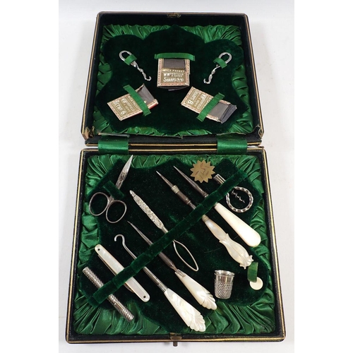 689 - A Victorian mother of pearl needlework and manicure set - cased