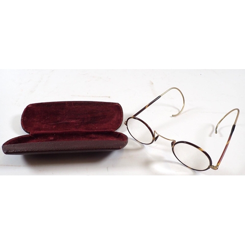 690 - A pair of tortoiseshell and gilt metal spectacles, cased