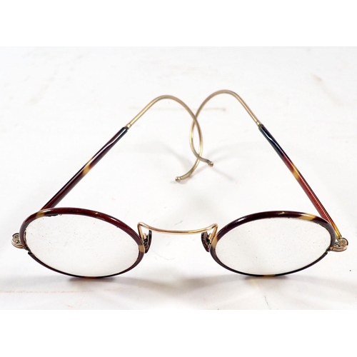 690 - A pair of tortoiseshell and gilt metal spectacles, cased