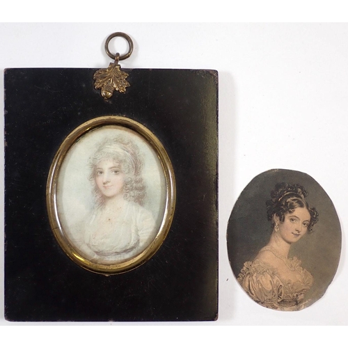 700 - Two 19th century printed miniature portraits and ebonised frame