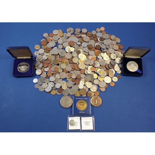 707 - A group of world coins and commemorative tokens including The Tower Mint Warwick Castle and Chester ... 