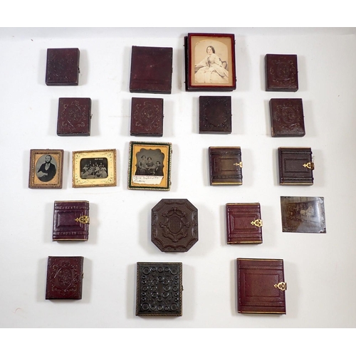 710 - A box of Victorian daguerreotypes in leather cases plus one in early pressed plastic case