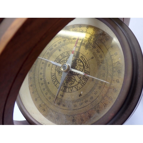 722 - A teak and brass framed vintage compass, 22cm tall