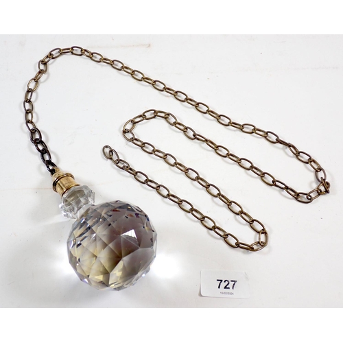 727 - A large cut glass faceted light pull on chain, 13cm tall