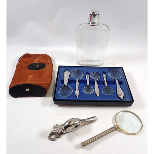 739 - A box containing a set of magnifying glasses, a hip flask and a cast metal mallard duck head paper c... 