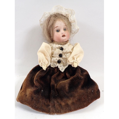 757 - A Victorian bisque headed small doll with porcelain legs, 16cm