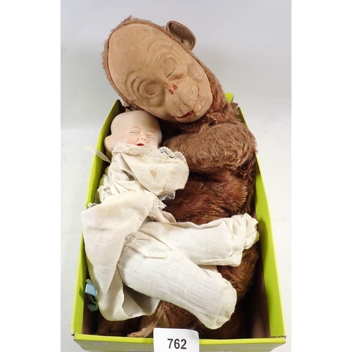 762 - A monkey nightdress case and a three faced doll