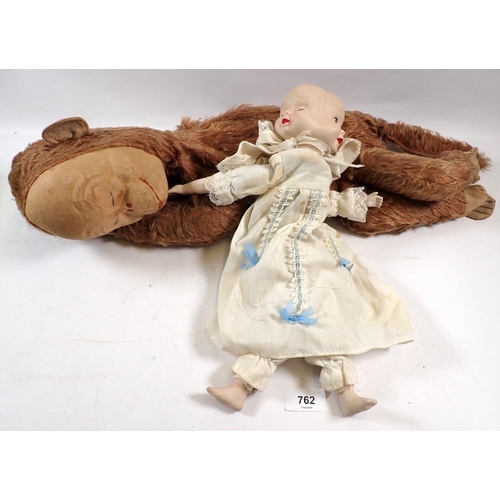 762 - A monkey nightdress case and a three faced doll