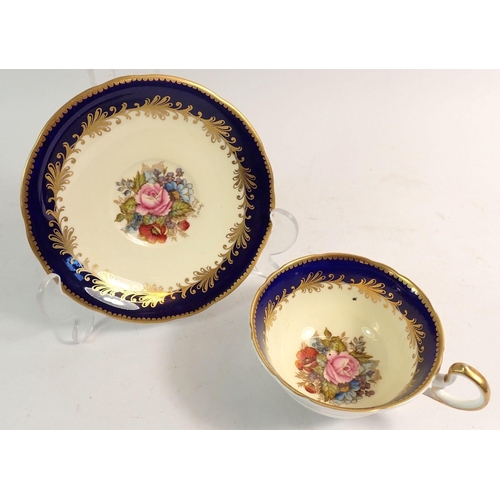 77 - An Ainsley cabinet cup and saucer painted flowers and signed R Bailey