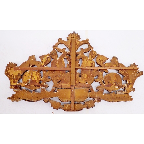 797 - An antique large carved wood and gilt gesso decorative over lintel crest depicting satyrs amid flowe... 