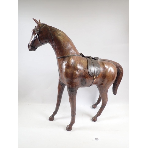 799 - A vintage Liberty style  leather over wood model of a horse with glass eyes, 52cm tall