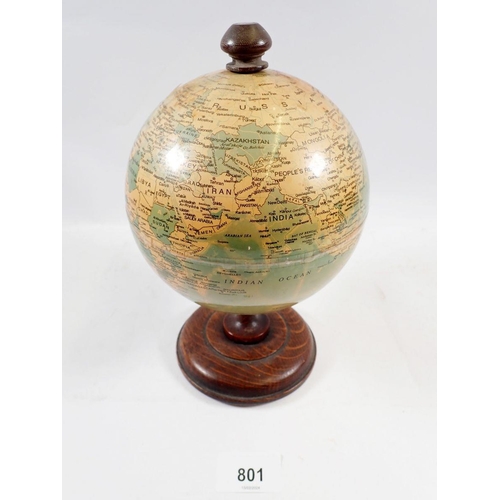 801 - A vintage small globe, 22cm tall