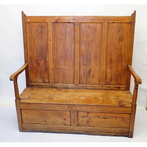 803 - An antique pine panelled settle, 140cm wide