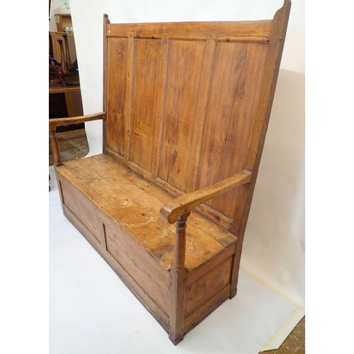 803 - An antique pine panelled settle, 140cm wide