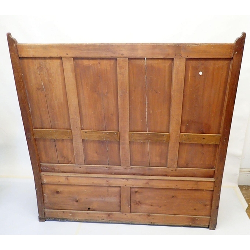 803 - An antique pine panelled settle, 140cm wide