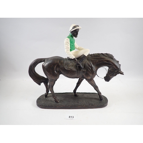 813 - A racehorse and jockey sculpture by John Skeating, 29cm