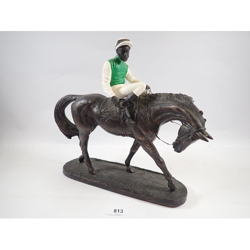 813 - A racehorse and jockey sculpture by John Skeating, 29cm