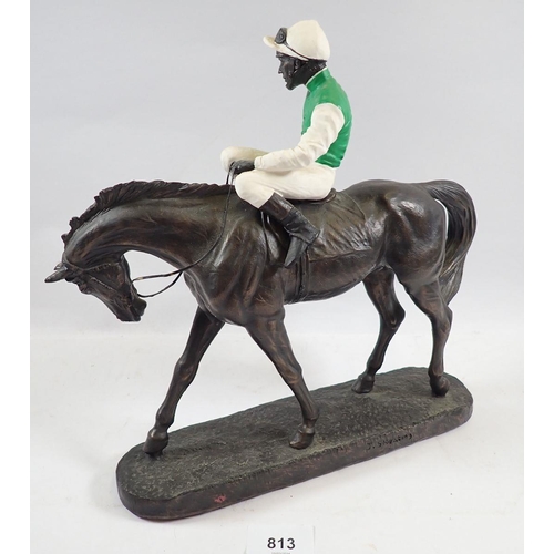 813 - A racehorse and jockey sculpture by John Skeating, 29cm