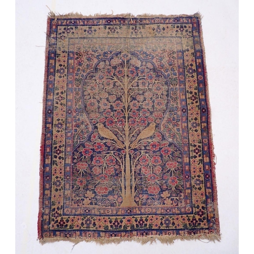 820 - A Persian rug with bird in flowering tree design, 120 x 90cm