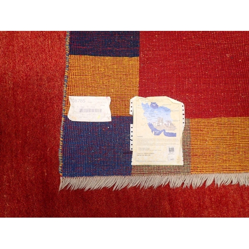 821 - A geometric coloured rug 186 x 142cm