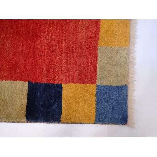 821 - A geometric coloured rug 186 x 142cm