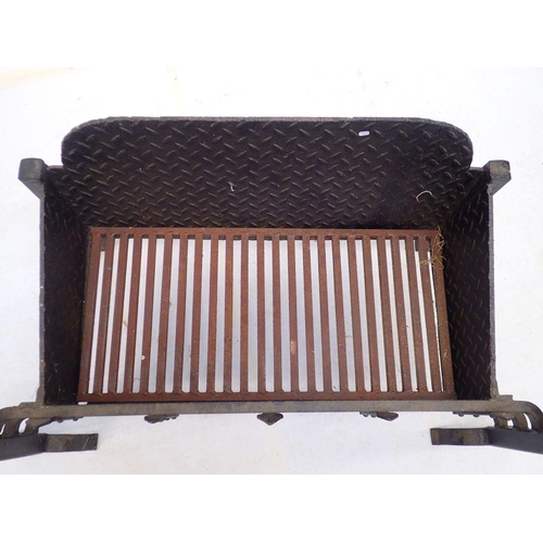 823 - A cast iron large fire grate, 112cm wide x 51cm tall x 49cm deep