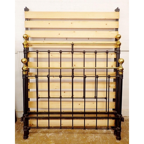 833 - A Victorian 4ft brass and iron double bed with brass finials