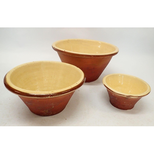 837 - A Victorian butter glazed graduated set of terracotta dairy bowls, 48, 37 and 25cm diameter