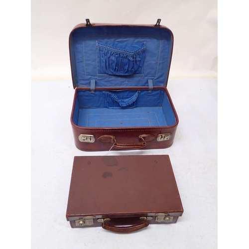 841 - A leather ladies suitcase with blue lining and another smaller suitcase