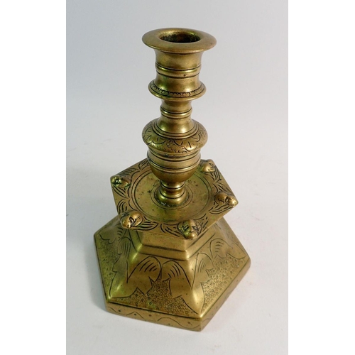 846 - A 19th century Dutch hexagonal brass candlestick with engraved decoration, 21cm