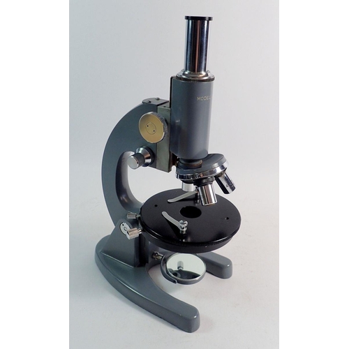 855 - A Chinese Model L-101 microscope with box of slides and solutions, -boxed, 37cm tall