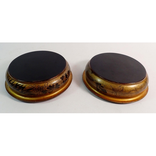 877 - A pair of Georgian lacquered wine coasters with butterfly and vine decoration, 14.5cm