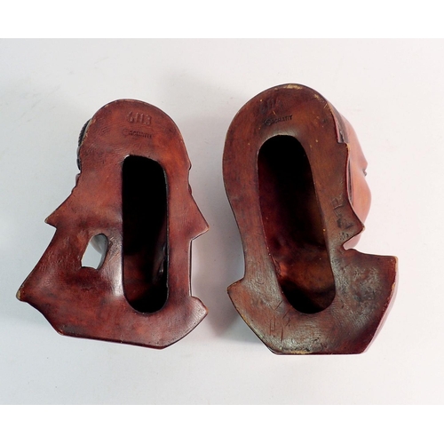 878 - Two Achatit wall masks, 19cm