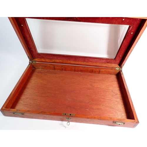 883 - A wooden glazed table top display case, 32 x 55cm