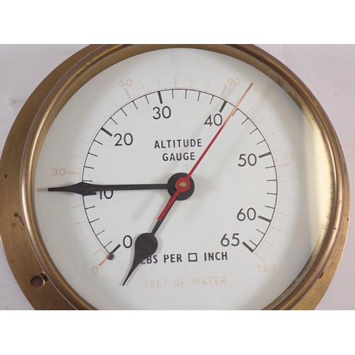 890 - A brass pressure gauge converted to a clock, face 14.5cm diameter