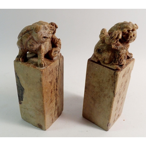 895 - A large pair of Qing Dynasty Chinese stone seals carved Foo dogs to tops and script, 18cm