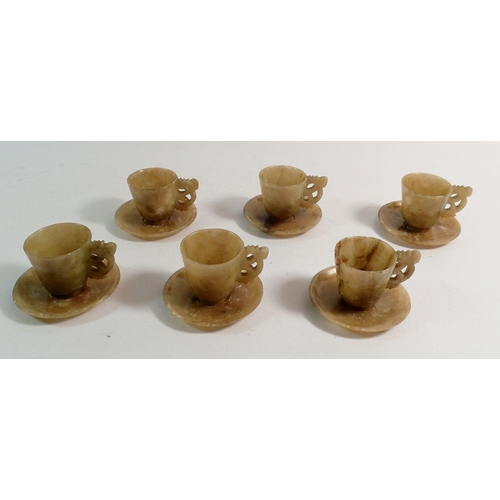 896 - A set of six Qing Dynasty Chinese jade miniature cups, 4.5cm tall and saucers with carved handles