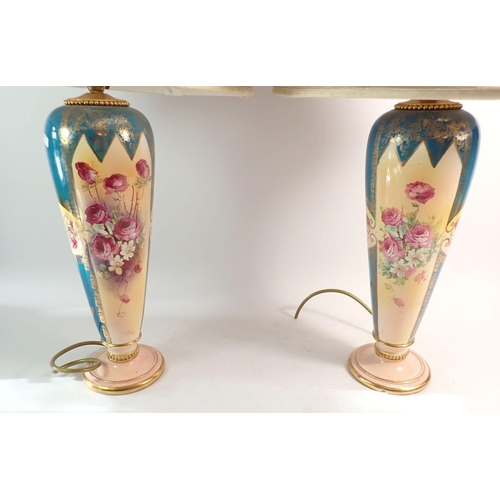 96 - A pair of Edwardian table lamps printed roses on a turquoise ground, 34cm