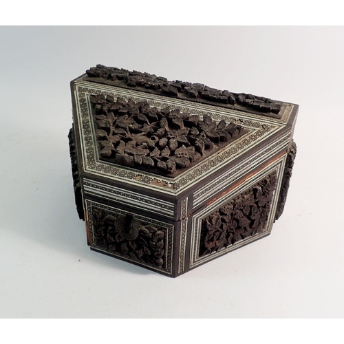 969 - An Indian carved and inlaid correspondence box with fitted interior, 23cm wide